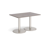 Monza rectangular dining table with flat round bases